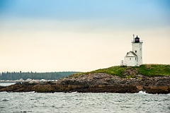 Two Bush Island Lighthouse Over Rocky Ledge in Maine